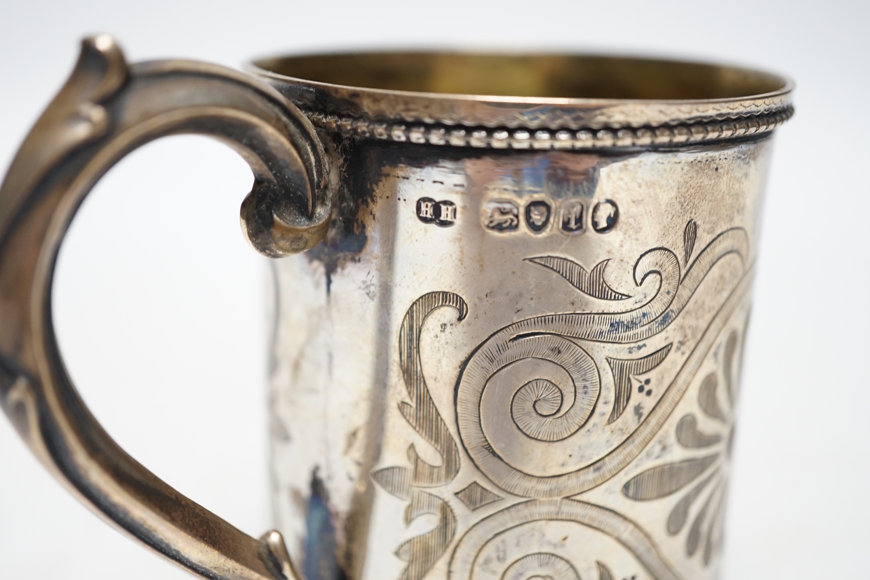 A Victorian engraved silver christening mug, Henry Holland, London, 1866, 87mm, 117 grams.